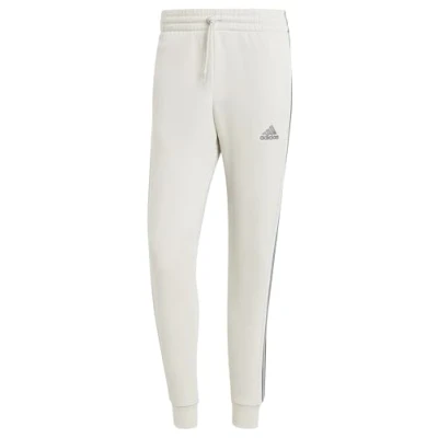 Image of adidas Men&#039;s Essentials Fleece 3 Stripes Tapered Cuff Pants, Shadow red, XL Short