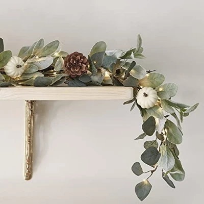 Image of Lights4fun 1.5m Eucalyptus White Pumpkin &amp; Pinecone Autumn Garland Indoor Decoration with Battery Operated Micro LED Fairy Lights