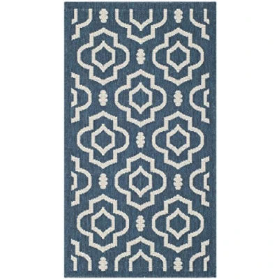 Image of SAFAVIEH Trellis Rug for Indoor &amp; Outdoor Courtyard Collection, Short Pile, in Navy and Beige color, 79 X 152 cm