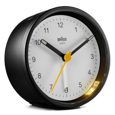 Image of Braun Classic Analogue Alarm Clock with Snooze and Light, Quiet Quartz Movement, Crescendo Beep in Black White, model BC12BW.